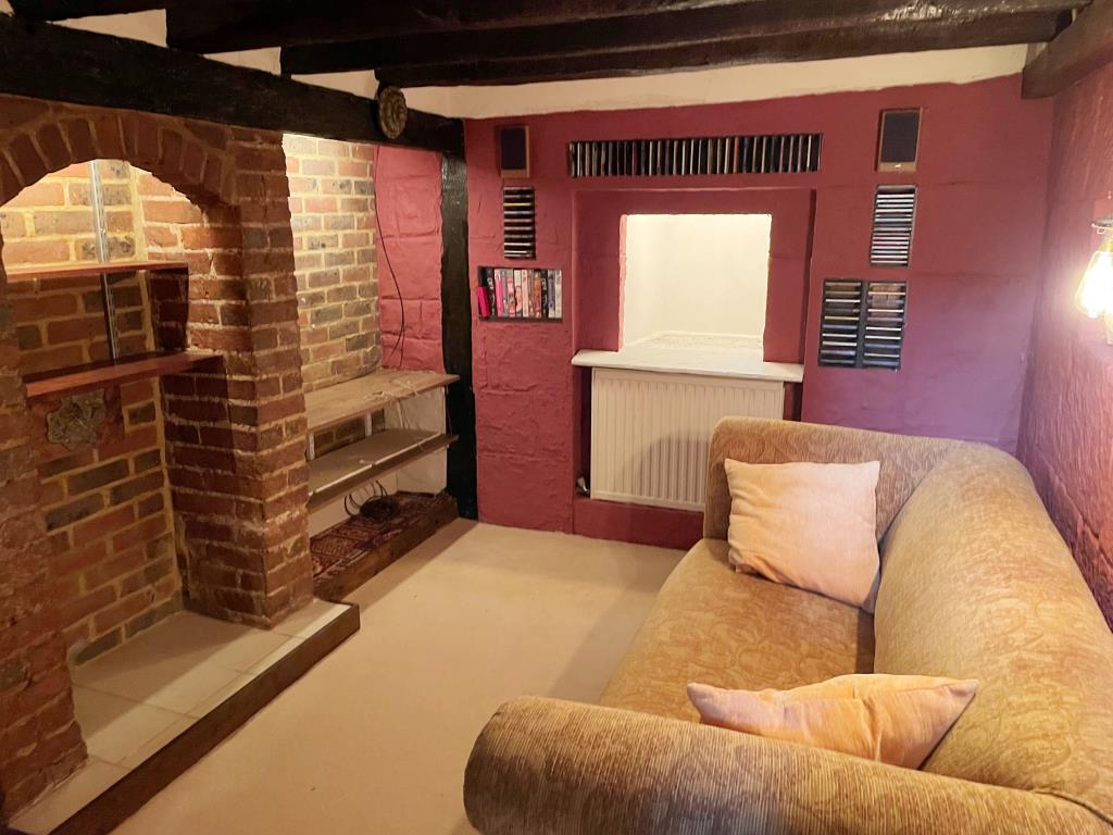 Lot: 10 - CHARACTER COTTAGE WITH GARAGE AND GARDENS - view of snug room on lower ground floor